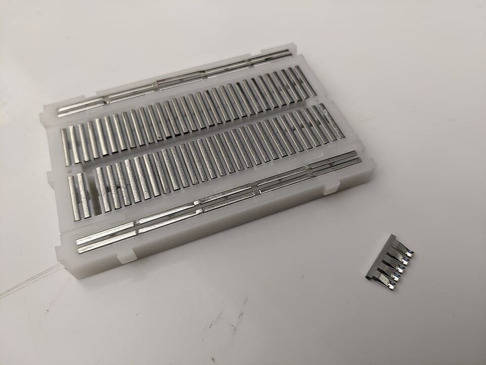 Metal contacts within a breadboard