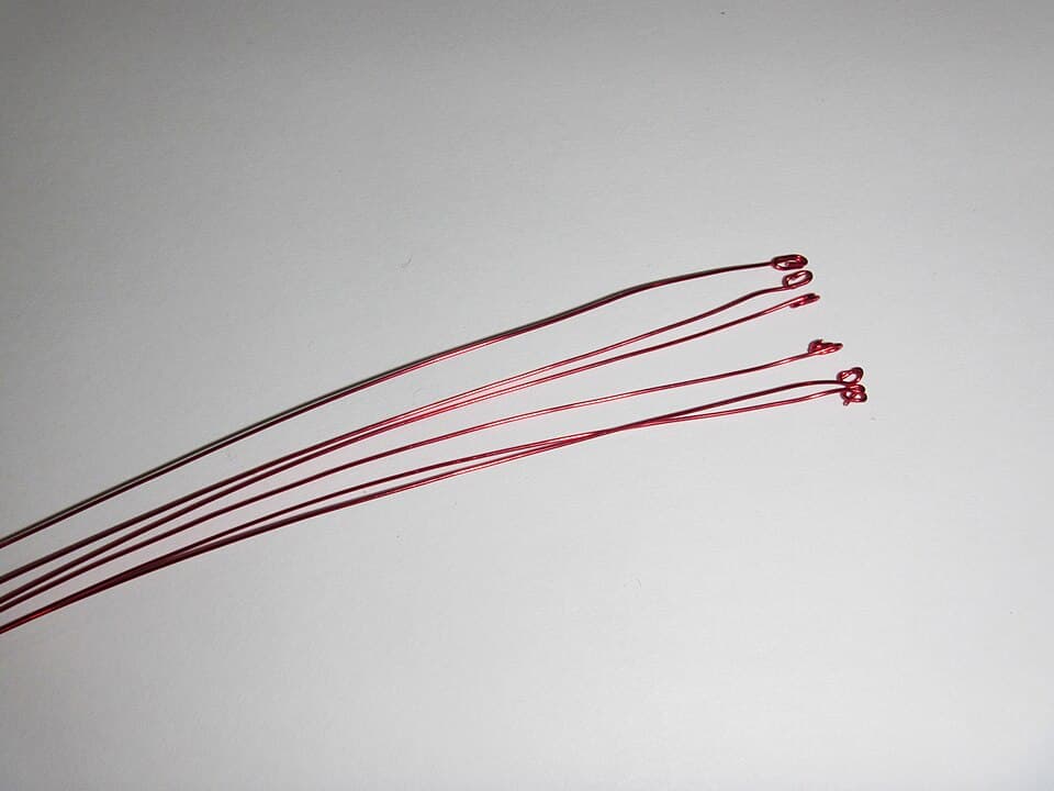Cut a length of ~26 AWG solderable magnet wire for each pin but DLC and curl and pinch the ends to form narrow solder pads (18562165486)